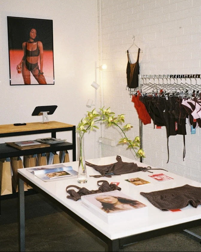 RAQ Retail store interior with clothing display, hangers, and a table with magazines. 22 cremorne st Cremorne

